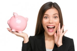 Woman holding piggy bank screaming excited